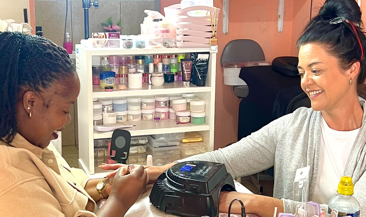 Client having her nails done inside PEY Beauty Parlour